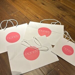 4 Paper bags.  3 medium and one small.